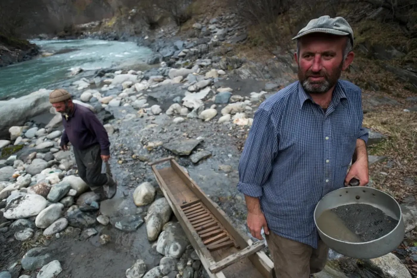 Searching for gold and gemstones in river placer deposits